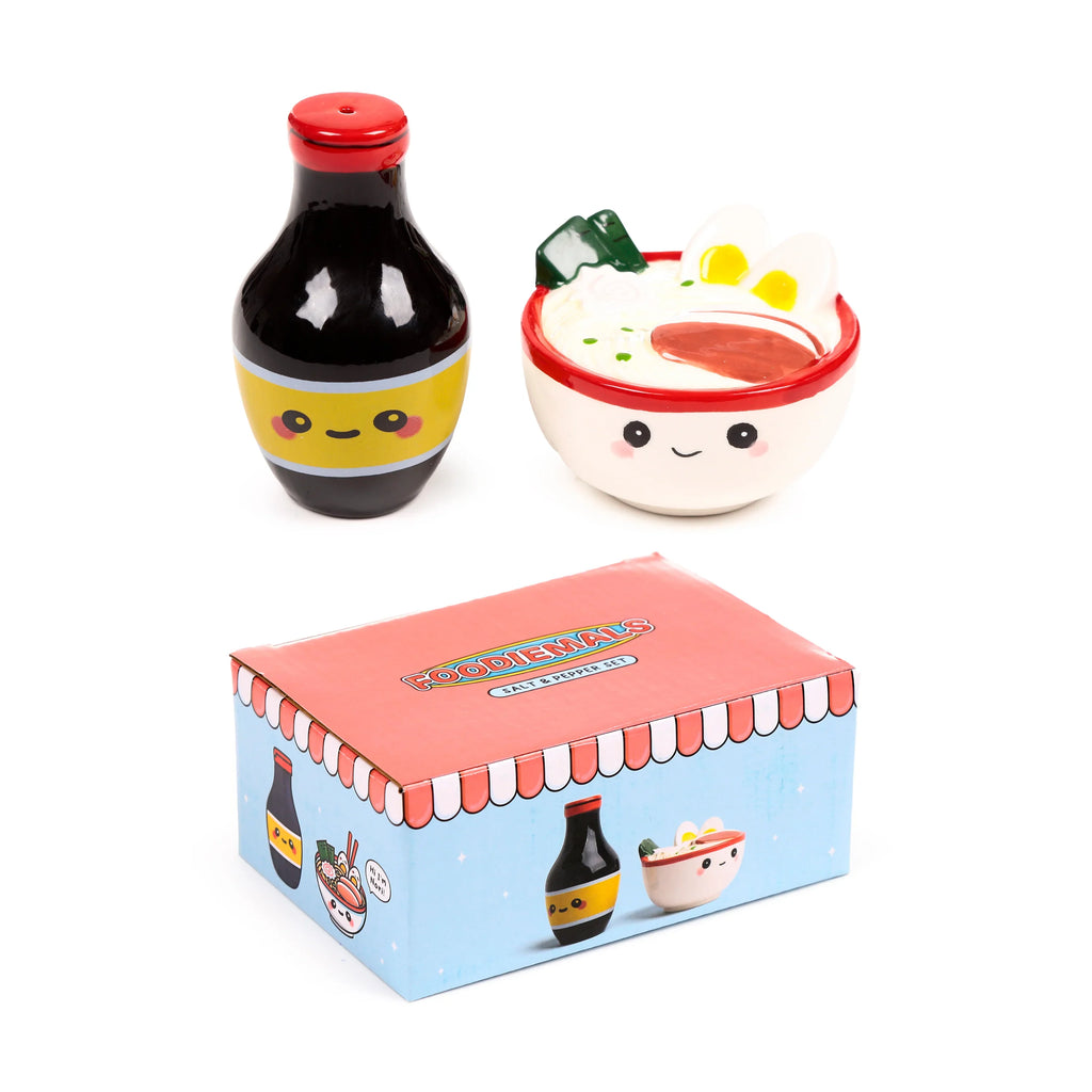 Ceramic salt and pepper set featuring a soy sauce bottle shaker and a ramen bowl shaker, both with cute faces. The set is displayed with its illustrated gift box, shown at an angle, on a white background.