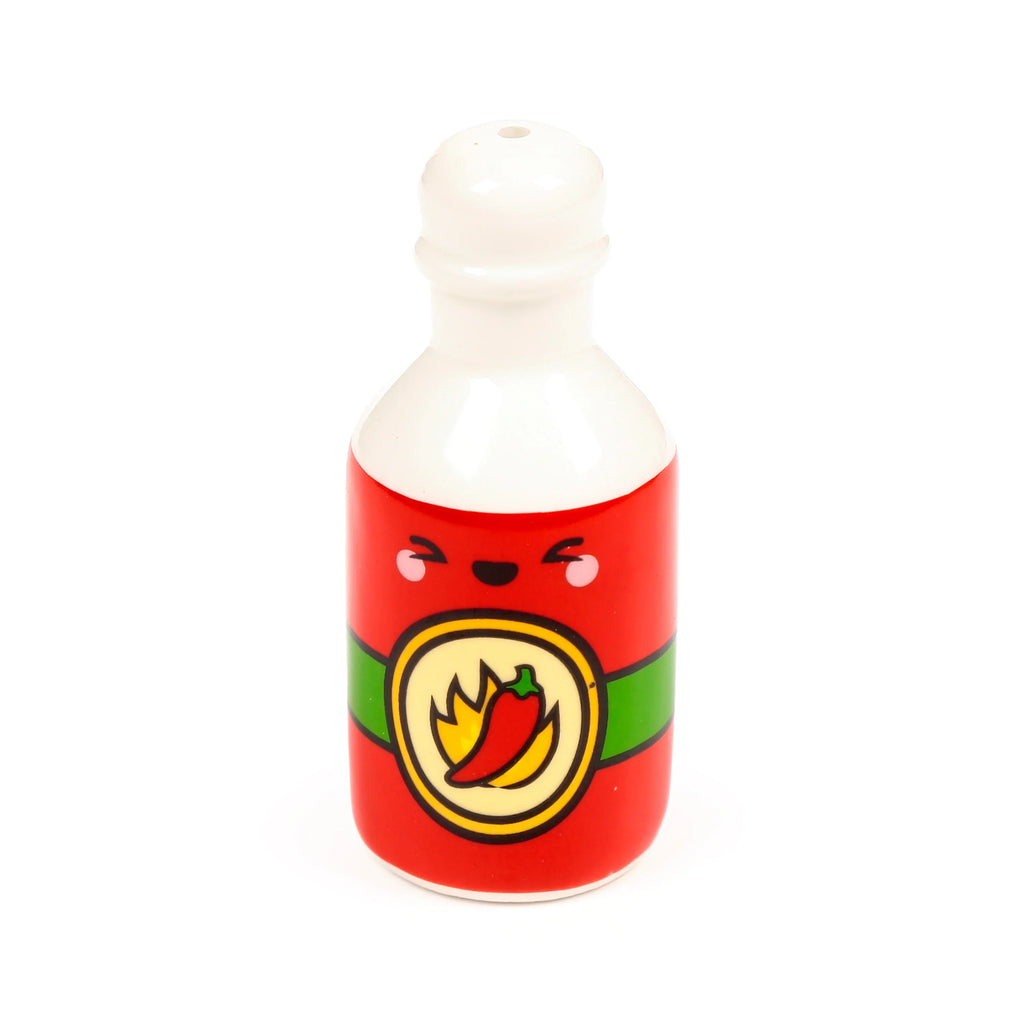 Front view of a red ceramic hot sauce bottle shaker, featuring an angry cartoon face and a circular emblem with a red chilli and flames.