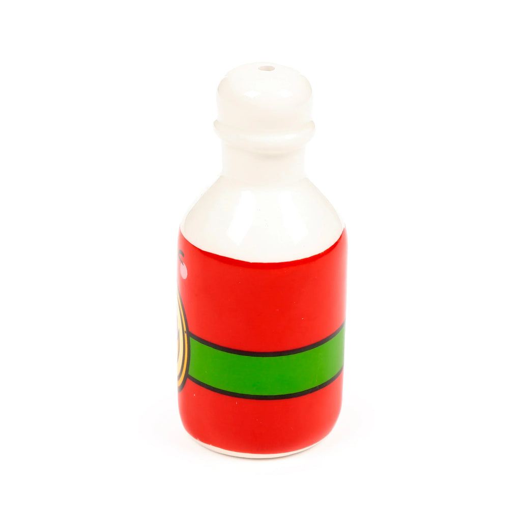 Angled front view of a ceramic hot sauce bottle shaker, predominantly red with a white top and base, featuring a green band with black outline and a partial yellow circular design, with a single dispensing hole on top.