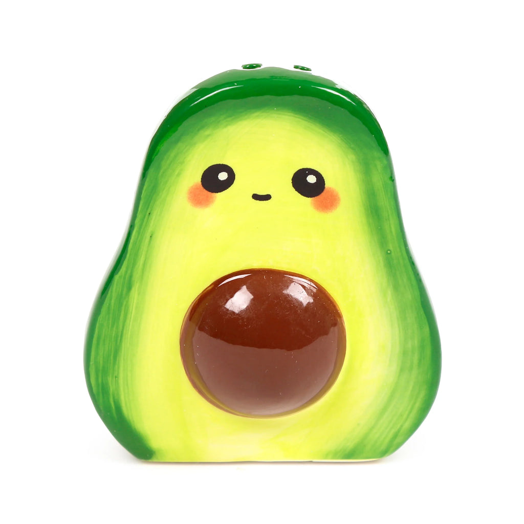 Front view of a ceramic avocado salt or pepper shaker, bright green and yellow, with a brown pit and a cute cartoon face.