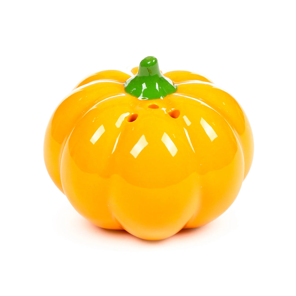 Angled view of a glossy orange ceramic pumpkin shaker, featuring a green stem and holes on top.