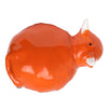 Angled top-down view of a glossy orange ceramic Highland Coo cow shaker, featuring white horns, a black eye, and a visible dispensing hole.