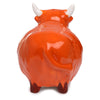 Back view of a glossy reddish-brown ceramic Highland Coo cow salt or pepper shaker, featuring white horns, a small curved tail, and two dispenser holes on its upper back.