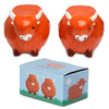 Angled view of two ceramic orange Highland coo salt and pepper shakers, featuring white horns and snouts. They are displayed above a light blue presentation box adorned with cartoon Highland cow illustrations, all on a white background.