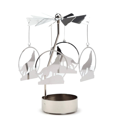 Silver-coloured spinning tea light carousel candle holder with four hanging polished metal howling wolf silhouettes, showing its full design.