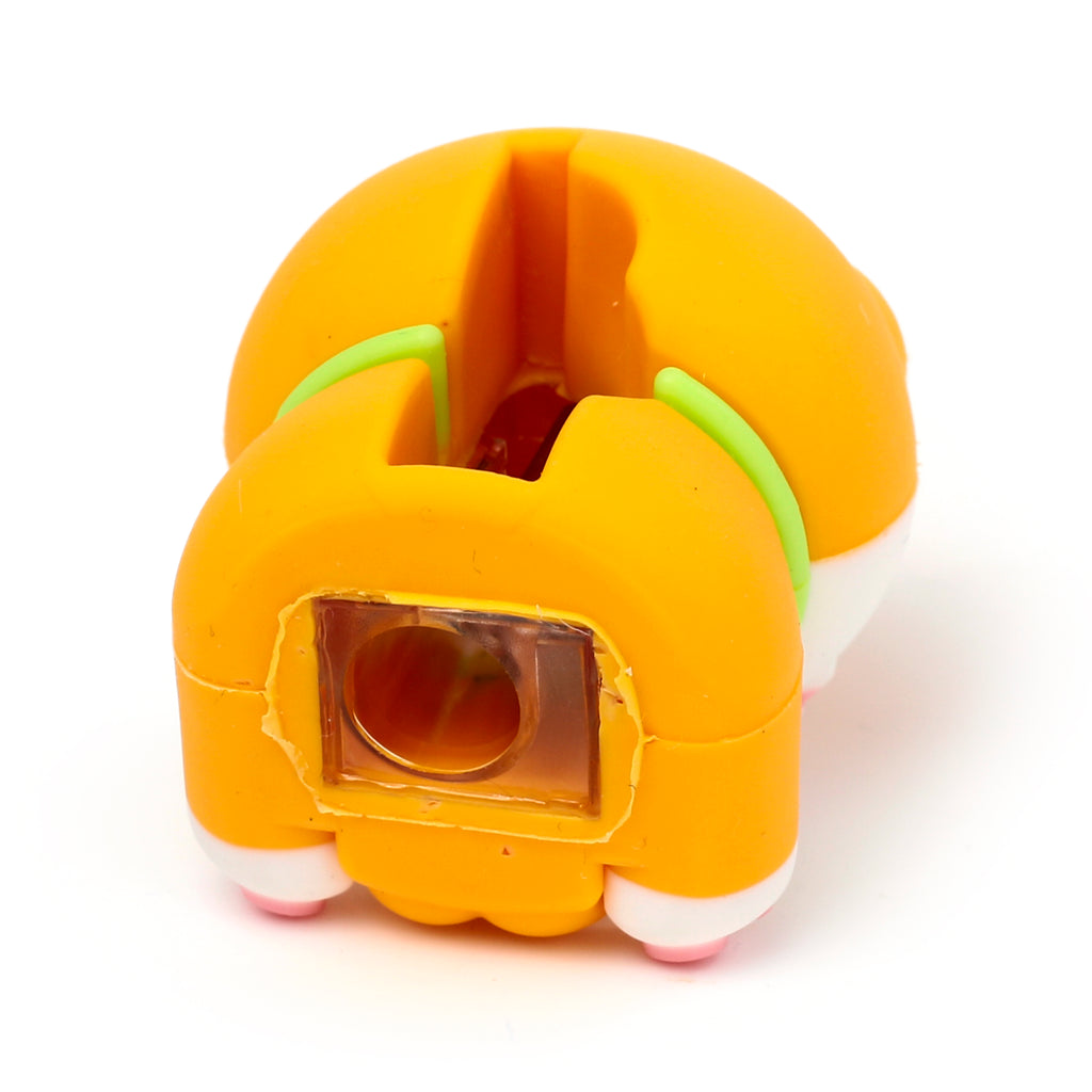Angled view of an orange and white Shiba Inu dog 2-in-1 sharpener and eraser, featuring its clear sharpener opening, light green collar, and pink paws.