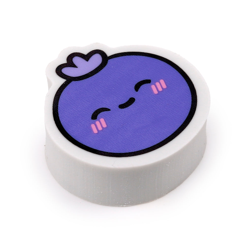 Angled view of a purple blueberry eraser, featuring a cute smiling face with pink blush marks and a small purple stem, on a white background.