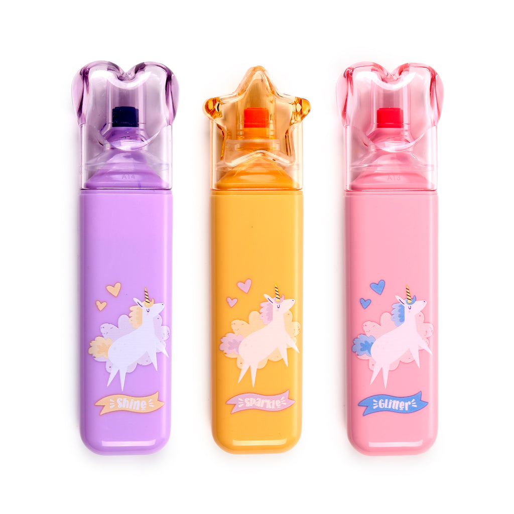 Front view of a set of three colourful unicorn highlighters on a white background. The highlighters are purple (with a heart-shaped cap and 'Shine' text), orange (with a star-shaped cap and 'Sparkle' text), and pink (with a heart-shaped cap and 'Glimmer' text).