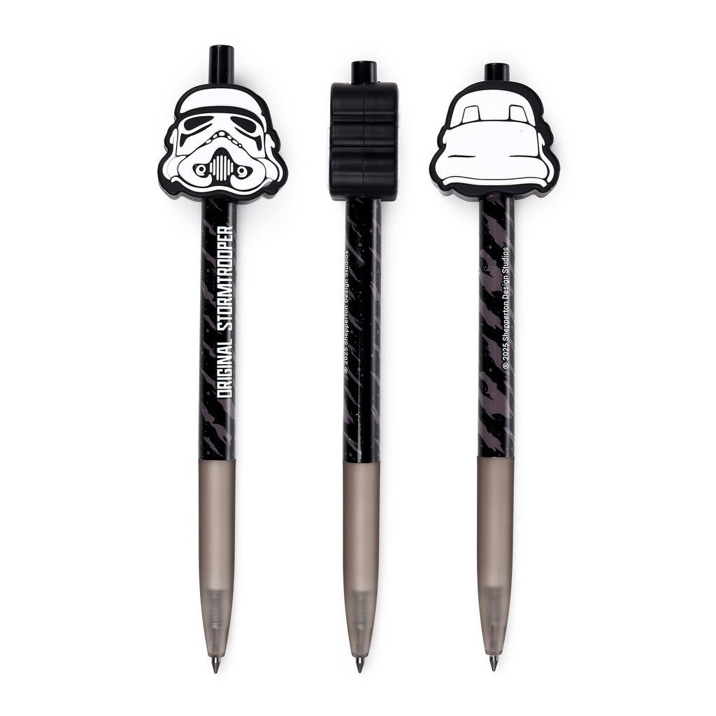 Three distinct views of an Original Stormtrooper everlasting pencil. The black, grey-speckled body transitions to a translucent grey barrel leading to a fine writing tip. One view shows the detailed front of the white Stormtrooper helmet topper with 'ORIGINAL STORMTROOPER' text, another highlights the black cap from above, and the third displays the helmet's rear.