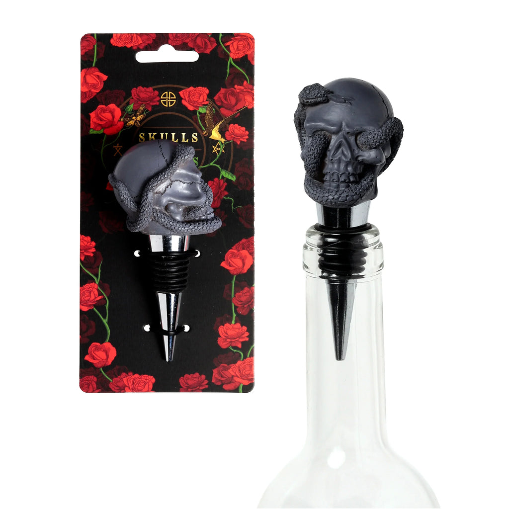 Front view of a novelty bottle stopper featuring a grey skull with a snake design, displayed on black packaging adorned with red roses, and also shown inserted into a clear glass bottle.