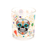 Front view of a clear glass tumbler featuring a colourful Day of the Dead sugar skull design with teal eyes, orange crosses, a flame motif, and surrounded by abstract shapes, hearts, diamonds, and confetti elements.