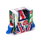 Angled view of a white, red, and blue Union Jack gorilla stretchy stress fidget toy, partially visible inside a green-patterned display box, with its blue limbs protruding from the sides.