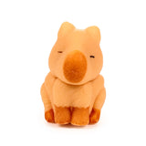 Front view of a light orange capybara hatching egg toy with a darker brown snout, closed eyes, and a textured finish.