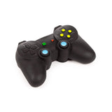 Angled view of a black game controller stretchy stress fidget toy, featuring yellow, green, and red buttons, with blue thumbsticks, on a white background.