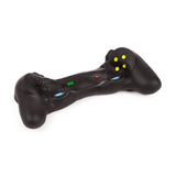 Angled overhead view of a black stretchy game controller fidget toy with colourful yellow, blue, red, and green button details.