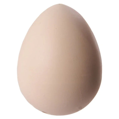 Upright view of a single, smooth, cream-coloured novelty hatching chicken egg toy on a white background.
