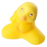 Front view of a bright yellow novelty hatching chicken toy, featuring black eyes and a small orange beak.