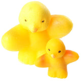 Angled view of a pair of yellow novelty hatching chicken toys, featuring one large and one smaller chick with black eyes and tiny beaks, and subtle orange detail on the smaller chick's wings, against a white background.