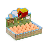 Angled view of a retail display box containing multiple light brown novelty bouncing rubber eggs, topped with a farmyard friends cartoon header.
