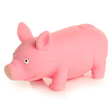 Angled view of a fun kids pink stretchy squeezy pig toy, featuring its cartoon eyes, snout, ears, and curly tail.