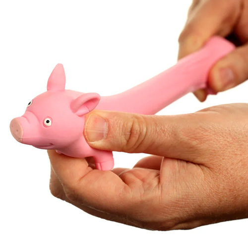 In-context image of a pink stretchy pig toy being stretched by hands, showcasing its flexible, elongated body and cartoon pig head with ears and snout.