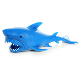 Blue stretchy squeezy shark toy, from an angled view showing its open mouth and sharp white teeth.