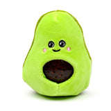 Front view of a green avocado-shaped Queasy Squeezies fidget toy, featuring an embroidered smiling face with pink cheeks and a dark, jelly-filled centre resembling an avocado stone.