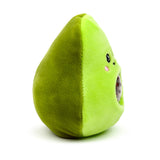 Two-tone green plush avocado fidget toy, showing its embroidered characterful face with black eyes and pink blush, and an exposed dark speckled squishy stone.