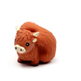 Front view of an orange Highland Coo stretchy fidget toy on a white background.