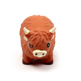 Front view of a brown Highland Coo stretchy fidget toy with textured fur, white horns, and a white snout, on a white background.