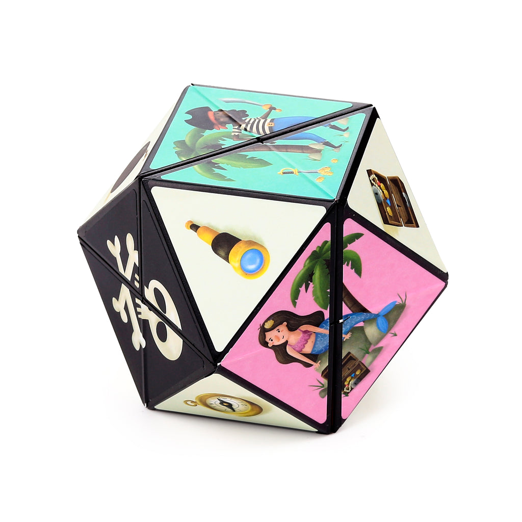 Angled view of a multi-faceted pirate puzzle cube toy, featuring a pirate with a cutlass on a turquoise panel, a mermaid with a treasure chest on a pink panel, a black section with white skull and crossbones, and other panels showing a telescope and compass.