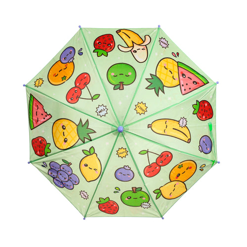 Overhead view of a kids umbrella with a light green canopy, patterned with an assortment of cartoon fruit characters such as strawberries, bananas, pineapples, and watermelon slices. Some characters also feature speech bubbles like 'YUM' and 'TASTY'.