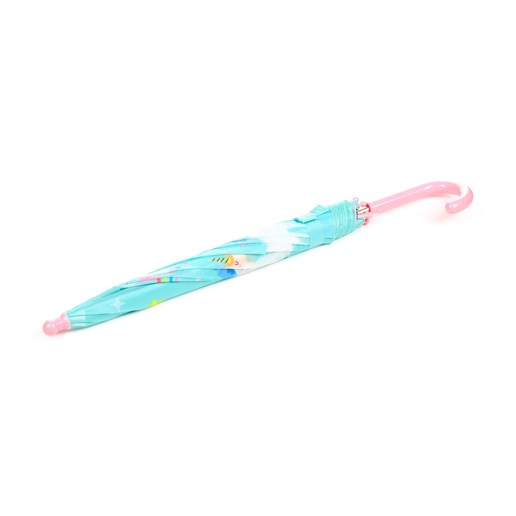 Angled view of a closed kids' umbrella, showing a light blue canopy with colourful pastel patterns, a pink hooked handle, and a pink rounded tip.