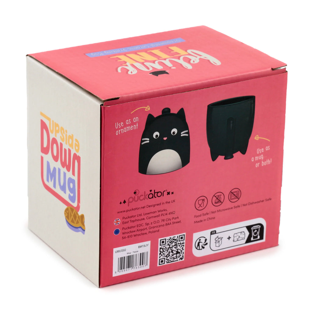 Angled view of a pink and white product box for a Feline Fine cat upside down ceramic mug, featuring illustrations of the black cat-shaped mug and 'Feline Fine' text on the top.