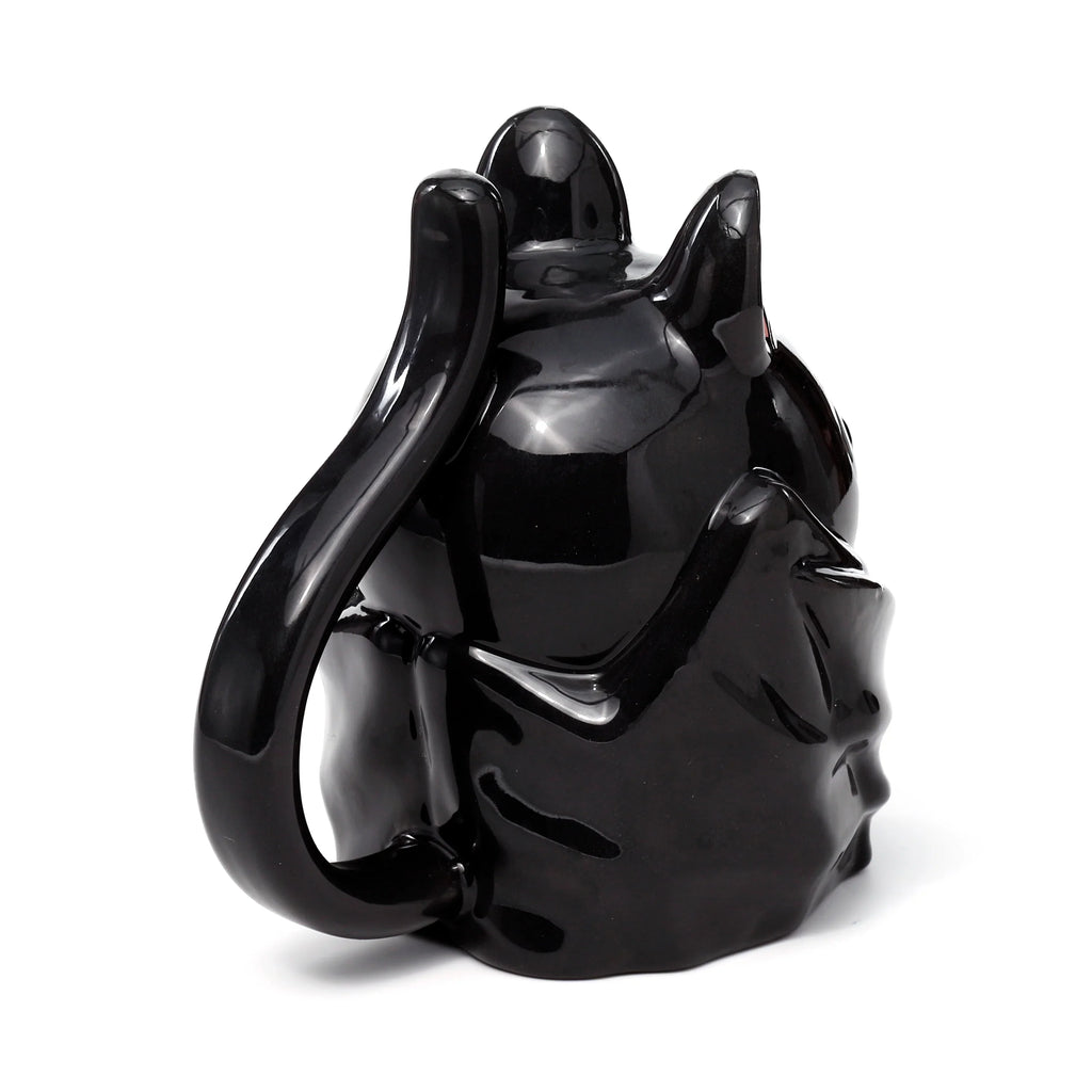 Angled rear view of a glossy black ceramic Novelty Upside Down Bat Mug, featuring its curved handle and pointed ears.