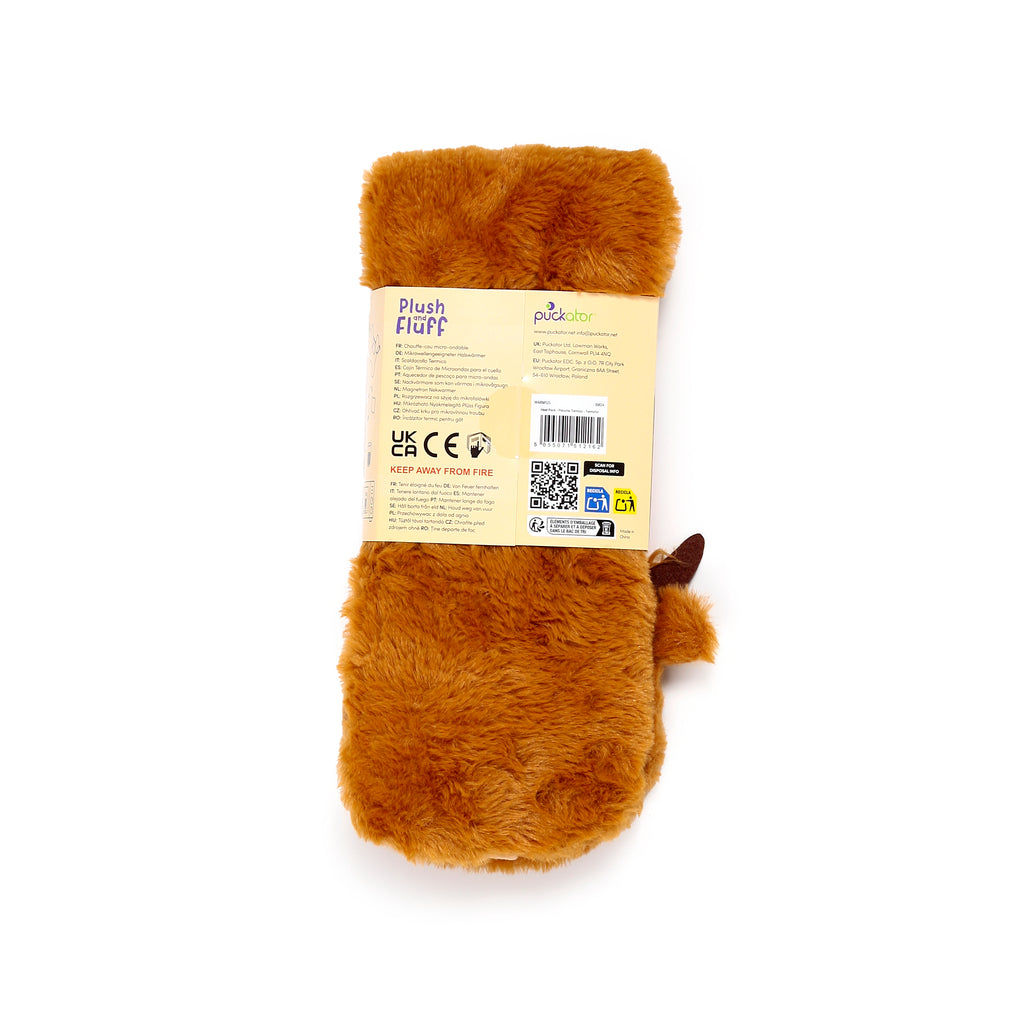 Reverse view of a brown fluffy microwavable neck warmer, displaying its attached product label with multi-lingual text, a barcode, and a small dark brown ear-like detail.