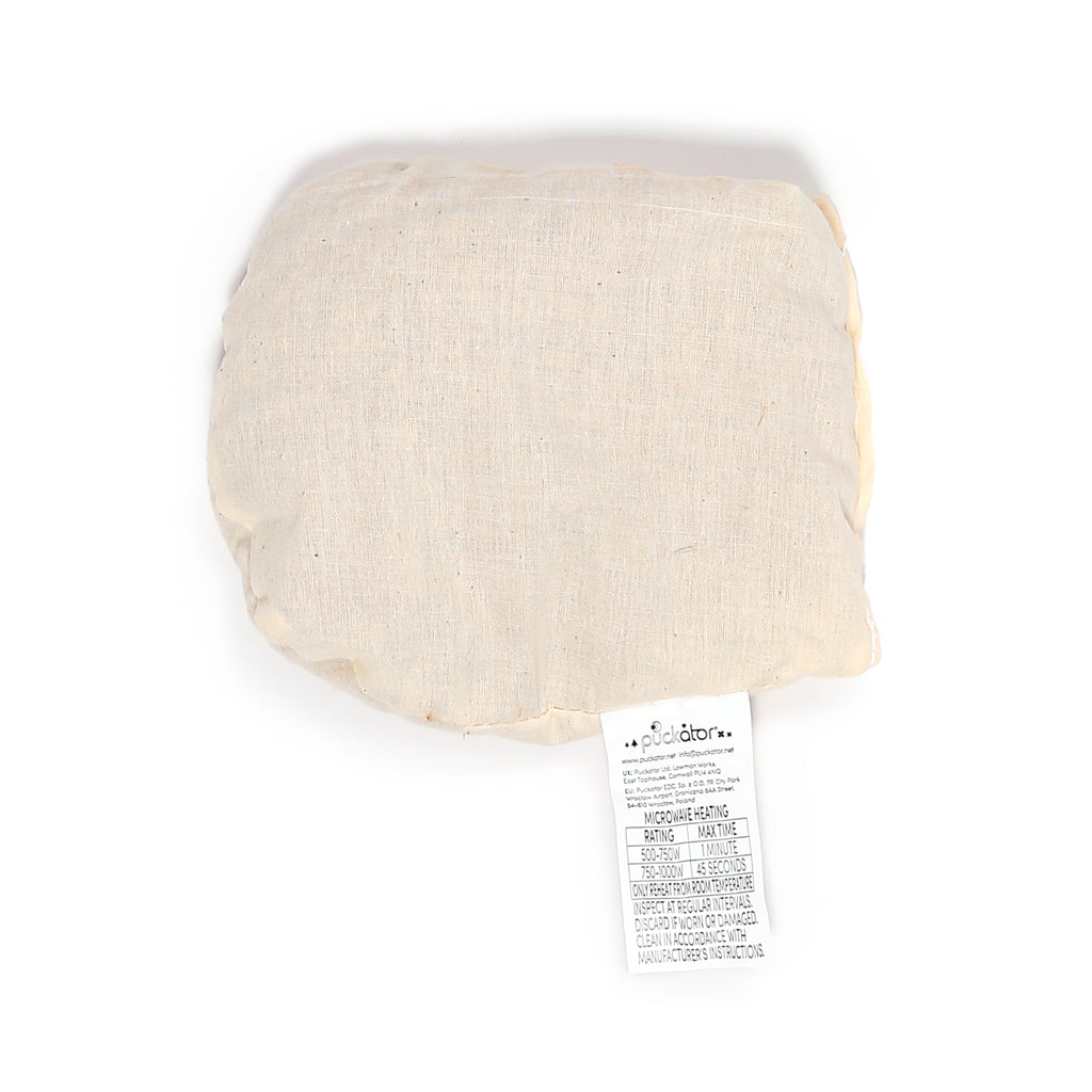 Microwavable lavender heat pack, cream-coloured with a woven texture, displaying its attached care label with microwave heating instructions.