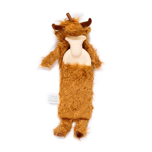 Overhead view of a long hot water bottle with a reddish-brown, shaggy Highland Coo plush cover, revealing the cream-coloured bottle neck.