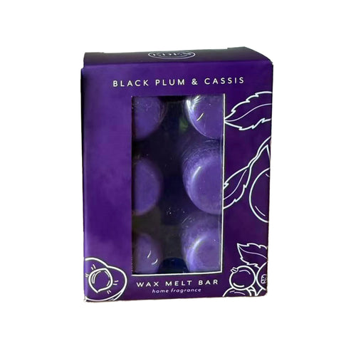 Angled view of a purple wax melt set box with a clear window revealing six circular purple wax melts inside. The box is decorated with white line art of plums and leaves, and features the text 'BLACK PLUM & CASSIS' and 'WAX MELT BAR home fragrance'.
