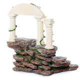 Fairy & Unicorn World figures display stand, featuring a multi-level rock formation with cream-coloured classical columns, an archway, and green moss detailing.