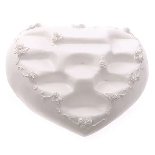 Top-down view of a white heart-shaped tiered display stand with decorative rose floral embellishments.