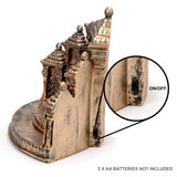 Side-back view of a golden, antique-finished Hindu temple-style LED display stand, with a magnified inset showing the on/off switch on its side panel.