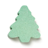 Overhead view of a green Christmas tree shaped bath bomb.