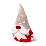 Angled view of a Christmas gonk plush toy with a pointed light beige hat featuring white polka dots, a red nose, a long white beard, and a red plush body with small mint green details, on a white background.
