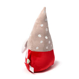 Angled view of a red Christmas gonk plush toy featuring a tall, beige conical hat with white polka dots, and a white beard with a light green nose visible.