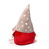 Angled view of a Christmas gonk plush toy, featuring a red body, a light brown pointed hat with white polka dots, a white beard, and green arms.