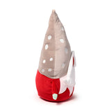 Plush Christmas gonk toy, angled to display its tall beige hat with white polka dots, red body, white beard on the side, and a small green-tipped tail.