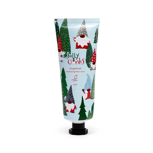 Front view of a light blue hand cream tube, featuring illustrations of Christmas gonks with red, grey, and blue hats, and green Christmas trees. The tube is labelled Jolly Gonks, Gingerbread moisturising hand cream, and 75ml, and has a black hexagonal cap.