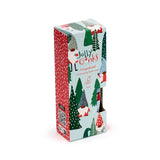 Angled view of a Christmas gonk hand cream box, depicting various gonk characters and green fir trees on a light blue background. The box also features a red side with white polka dots and text for 'Gingerbread moisturising hand cream 75ml'.