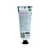 Back view of a light blue 75ml hand cream tube, adorned with a green Christmas tree design at the top. The tube prominently displays 'Gingerbread moisturising hand cream' text, along with multilingual information and a black screw cap.